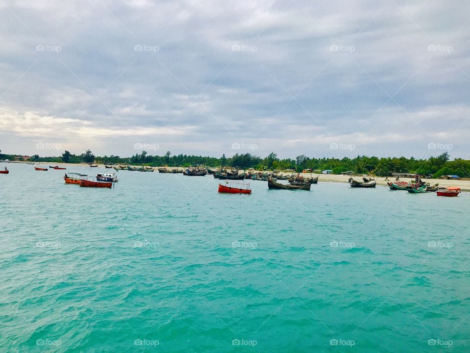 A beautiful combination of natural resources ,                   A cloudy sky with blue water and green atmosphere can attract anyone easily !!! 🏖