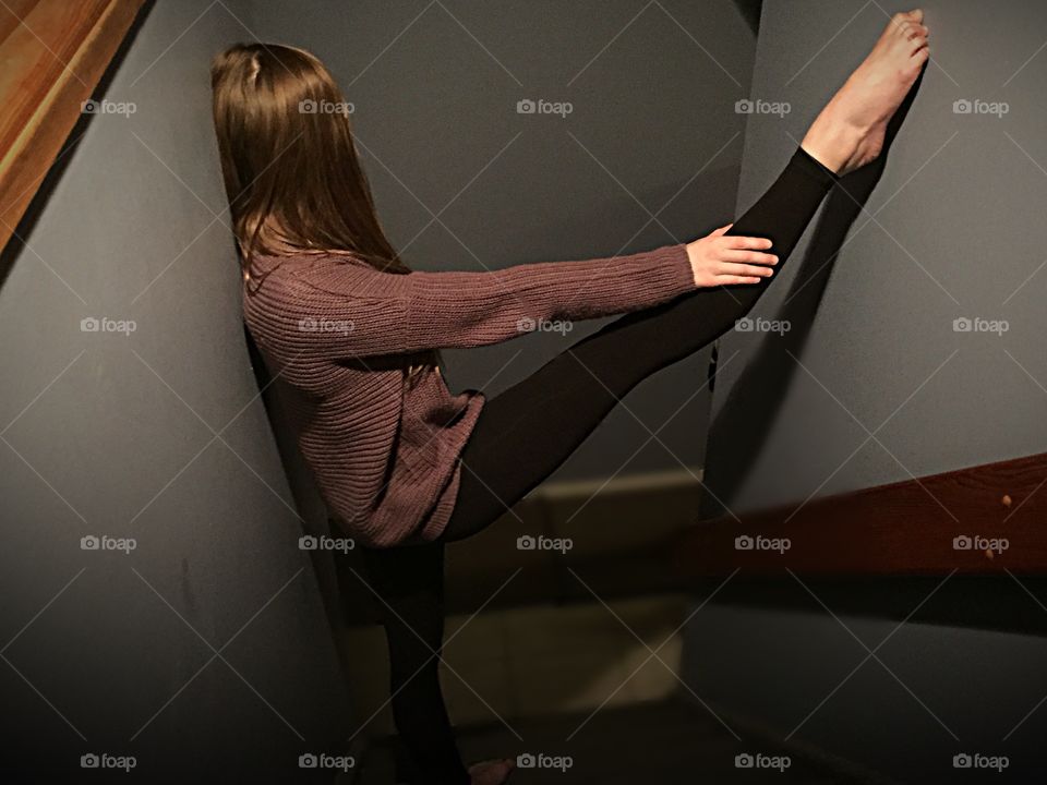 Girl standing on stairs in a dance position