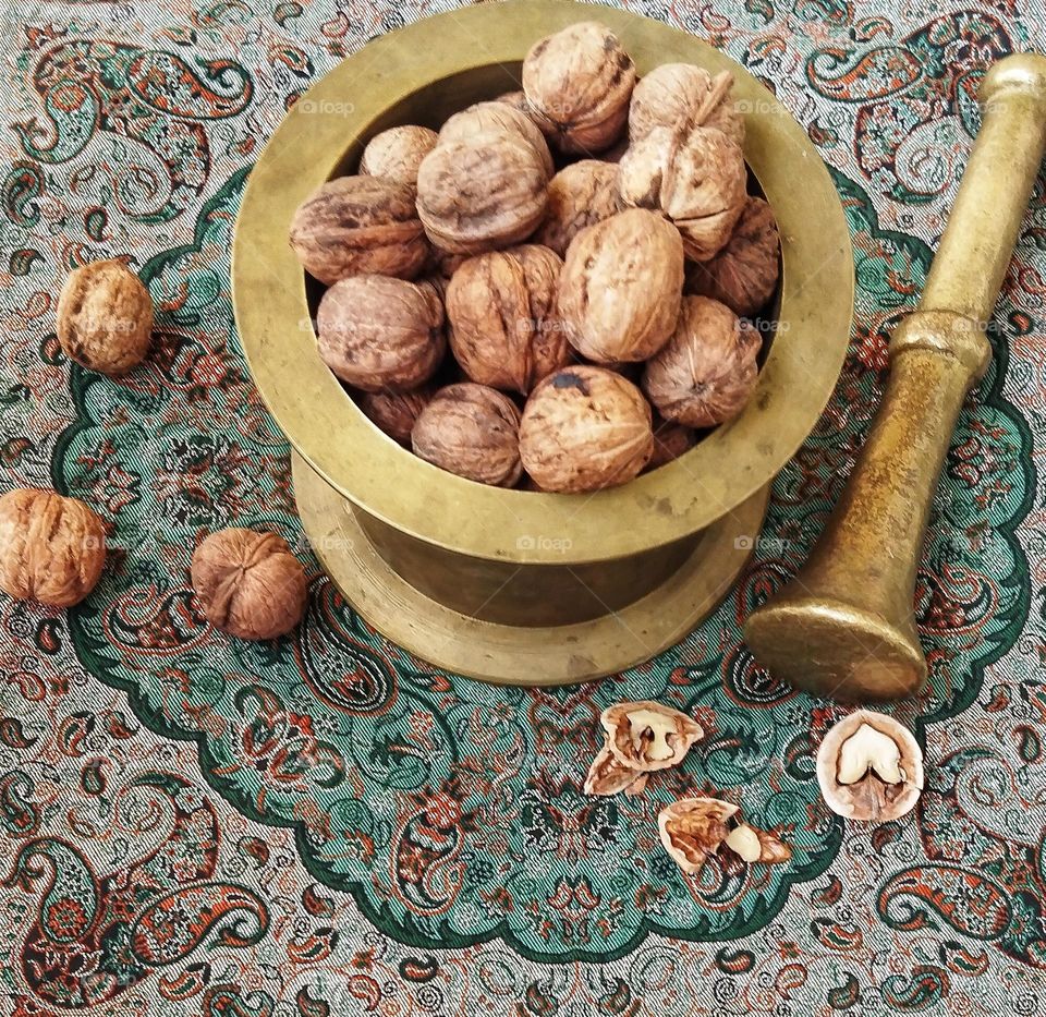 Can you guess how big this brass mortar is?!height of the pestle: 23 cm,height of the mortar:11 cm and the diameter of the mortar: 17 cm. 
This antique was given to me(age:more than a century)maybe because I have been interested in they love me too