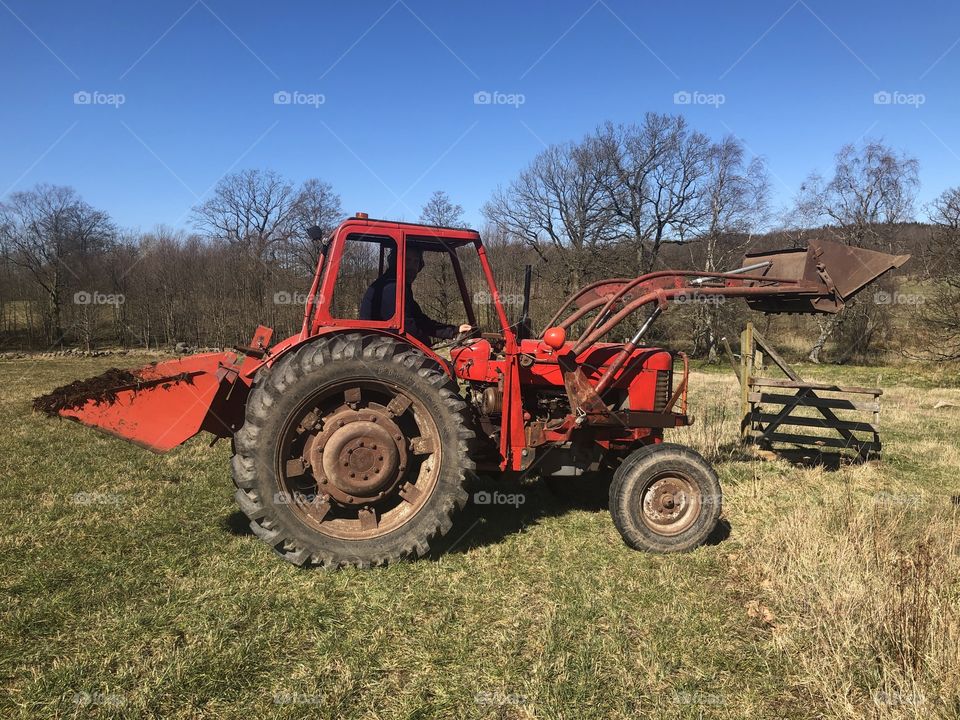 Farmer and red tractor