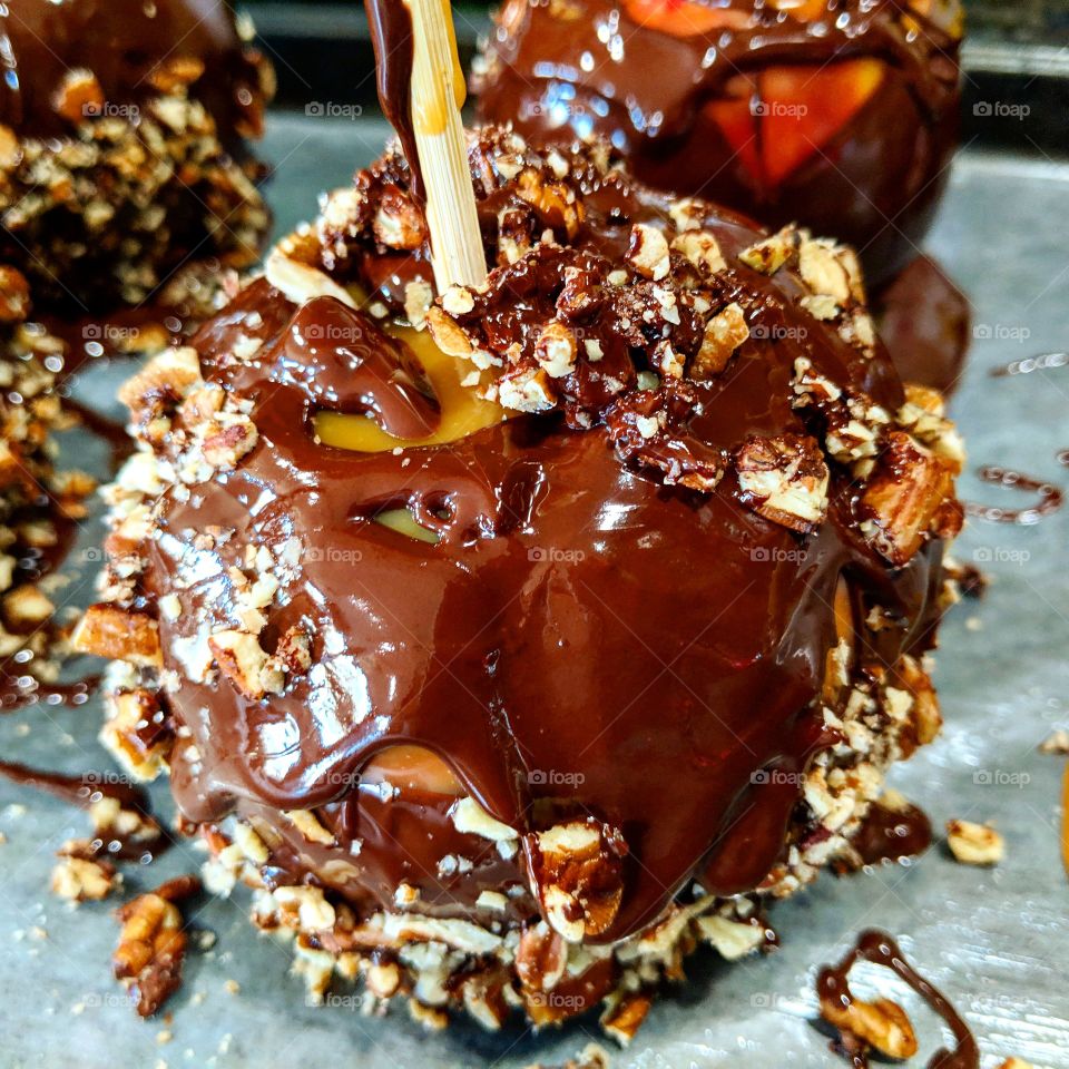 Nothing says autumn as much as a caramel apple. Especially if that apple is also covered in decadent dark chocolate and sweet pecans. It's a real treat.