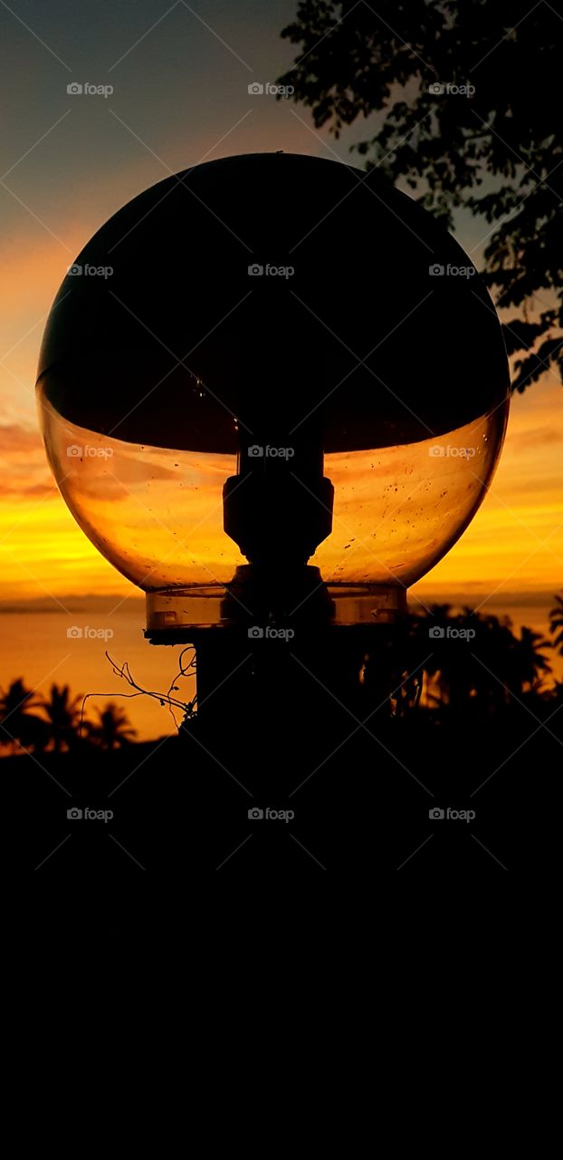 #streetlight #sun #sunrise #sea #philippines #travel #glass