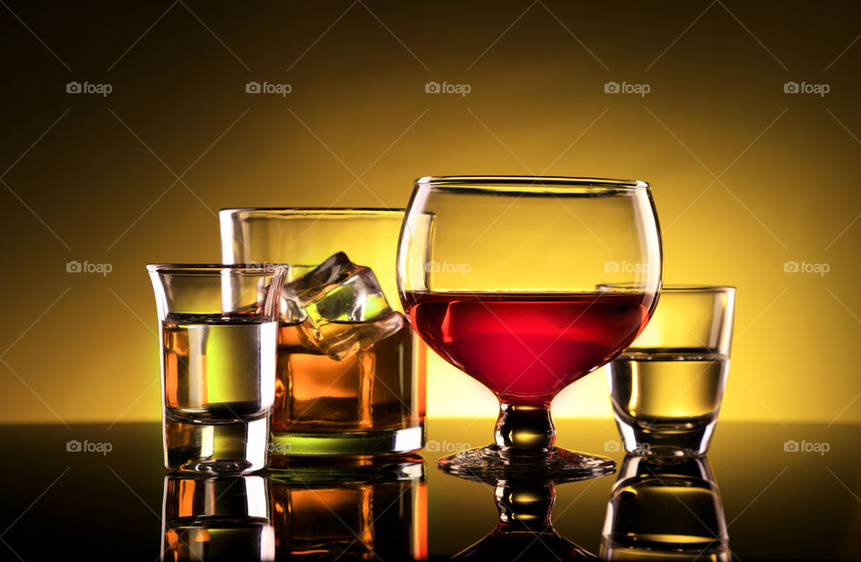 Different kind of glasses - red wine, whisky, tequila vodka shot