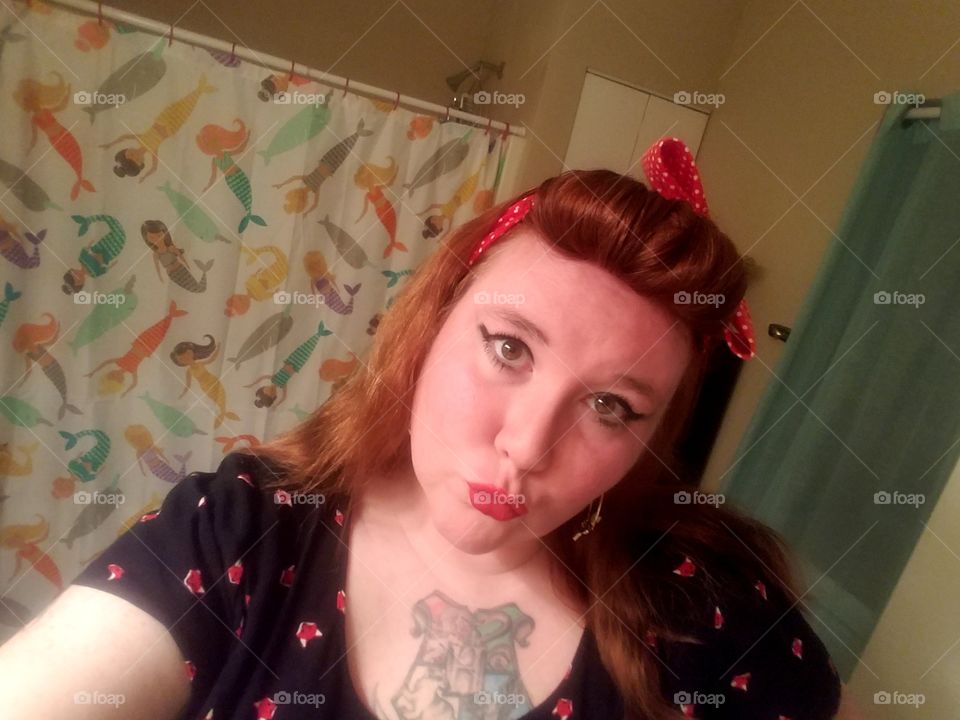Rockabilly girl, ready for a night out. Redhead duckface.