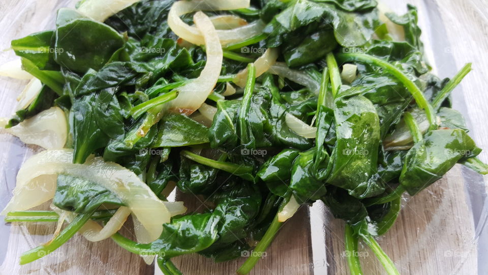 Green sautéed spinach and onions