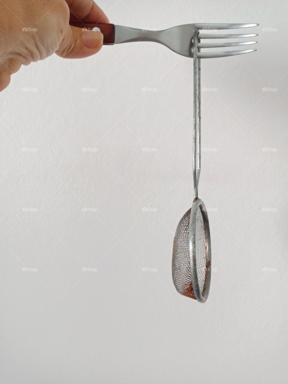 holding a strainer
