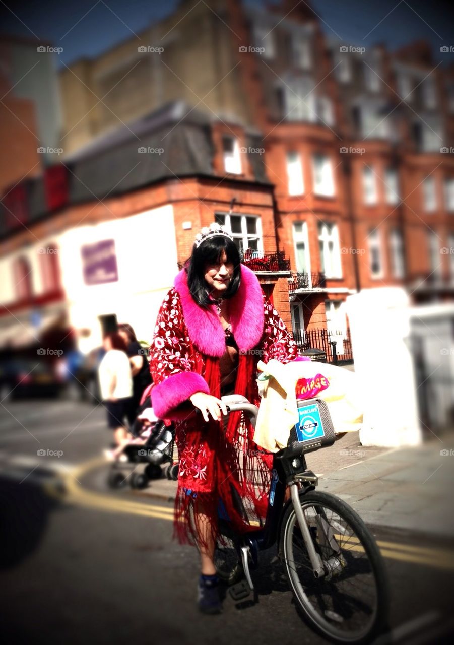 Man dressed as queen on Boris bike London