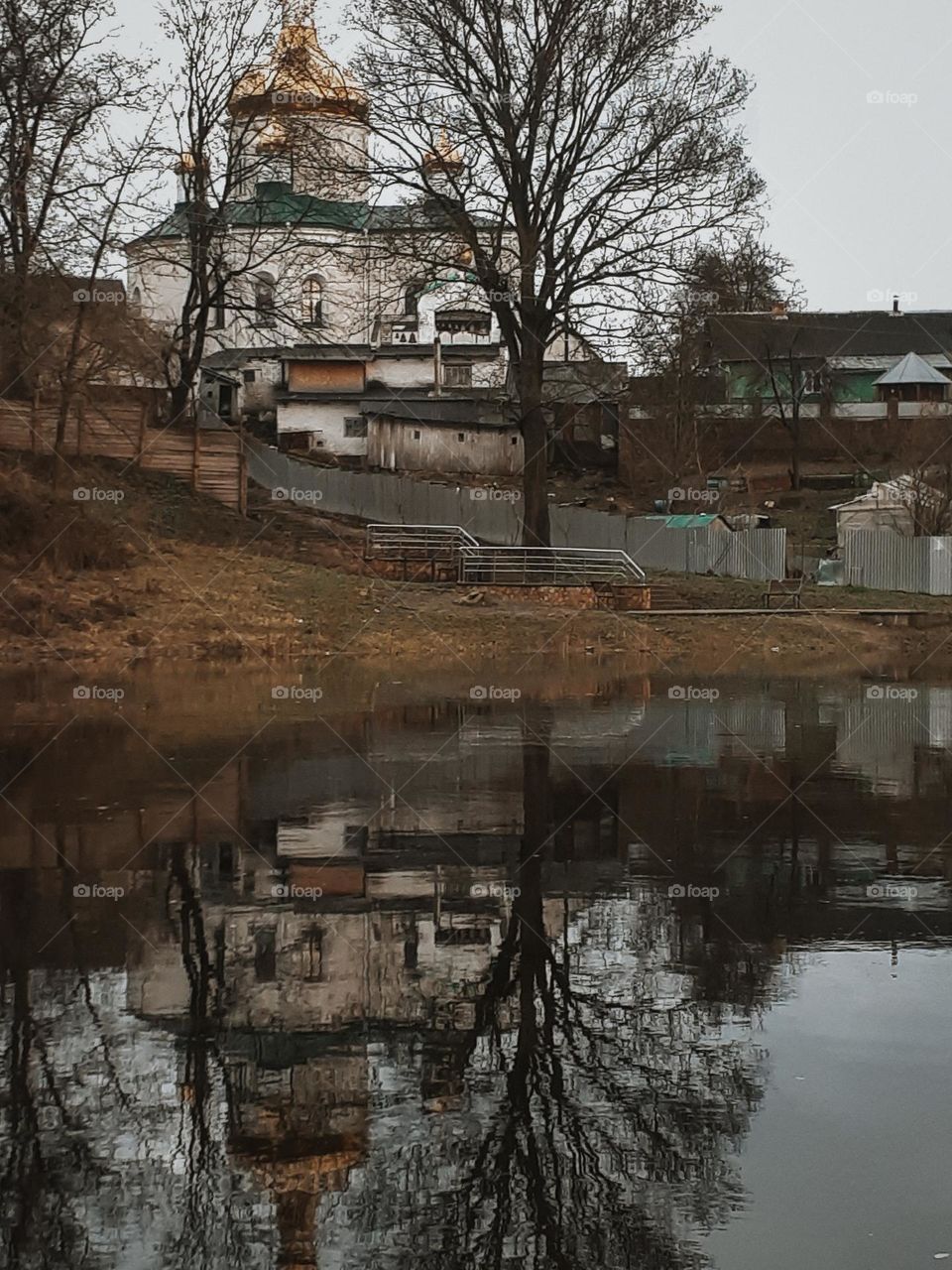 Photo of a Christian church reflected in the water