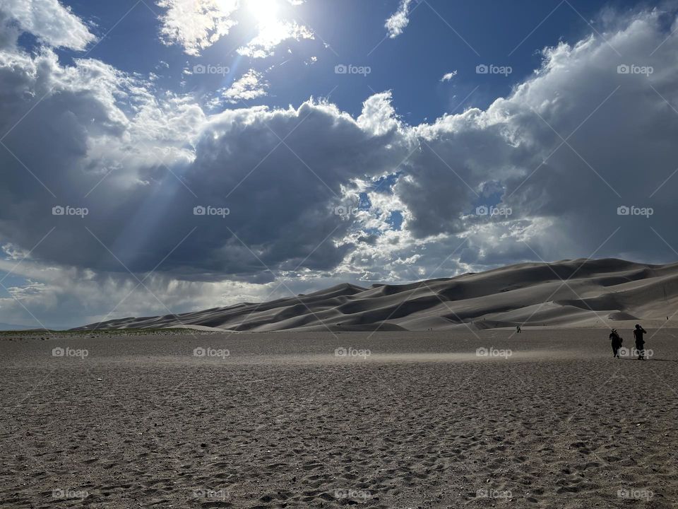 Huge sand dunes looming in the background at Great Sand dunes national park. 