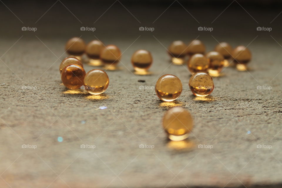 Pills, lights, ice, balls, hand, concrete, pills in hand, beautiful background, glass, round glass, glass balls, LEDs, capsules, bokeh,