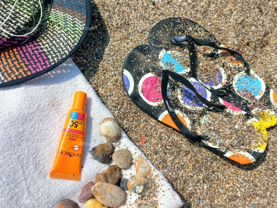 sunscreen on the sea sand.
