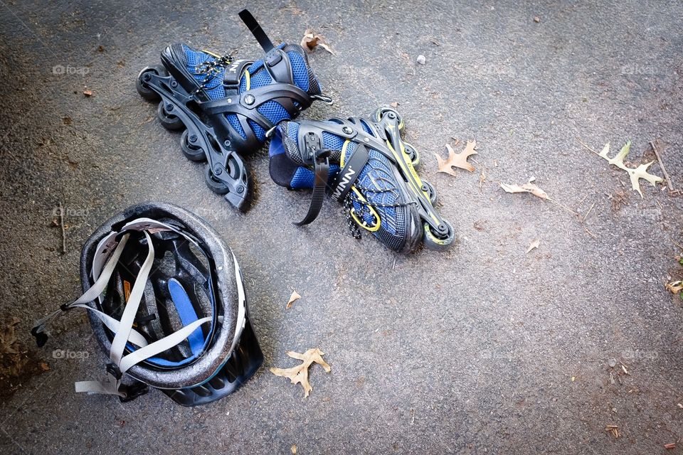 Roller blades and helmet left in driveway 