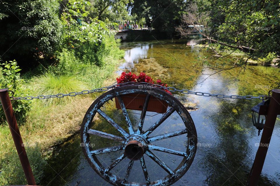 old wheel on the fence