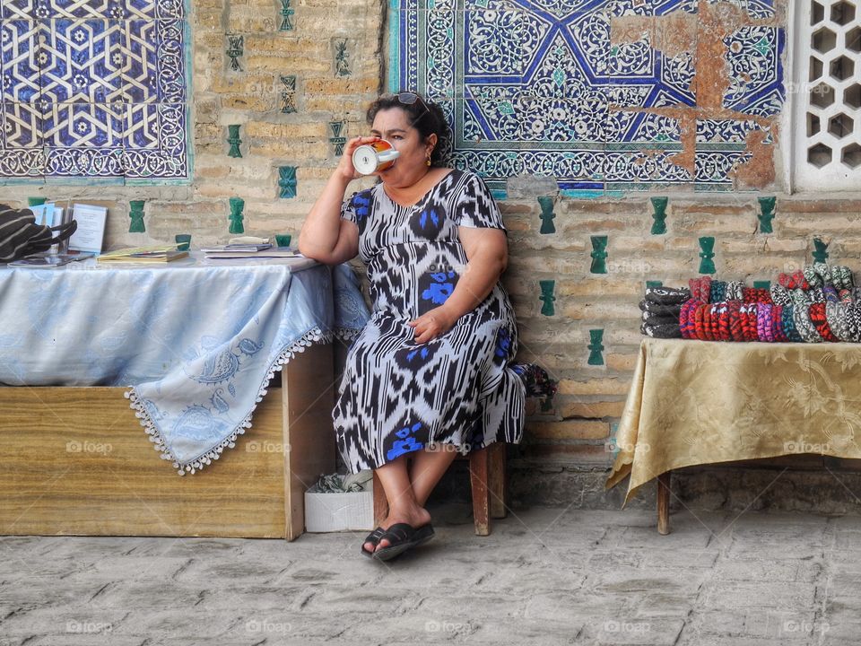 Tea time. . This lady works in museum at Khiva, Uzbekistan. She decided to take a short break and get her cup of tea. My cam ready. 