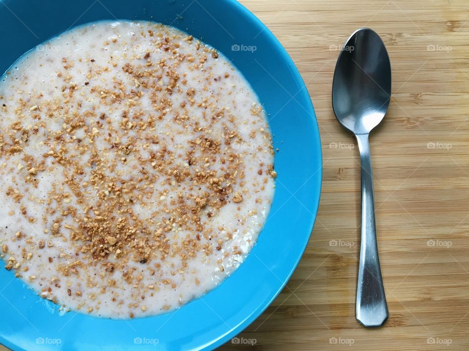 Sweet canjica with condensed milk and roasted peanuts (typical Brazilian recipe for winter)