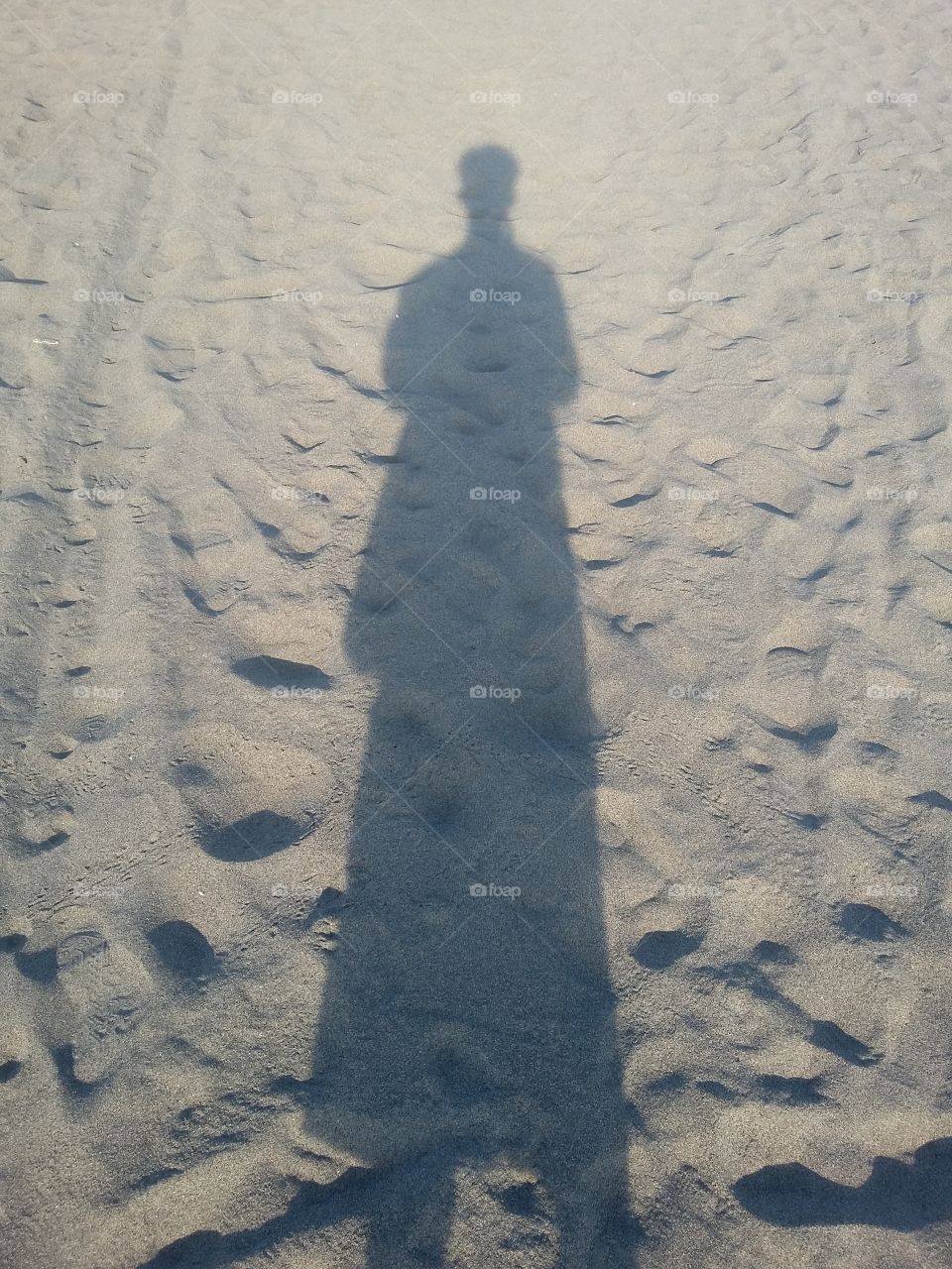 shadow people on the sand