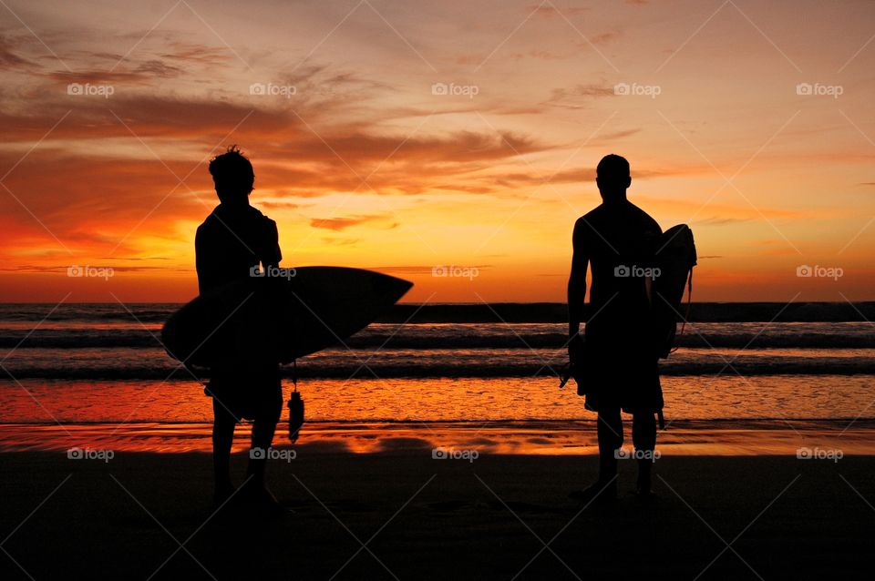 sunset and surfer