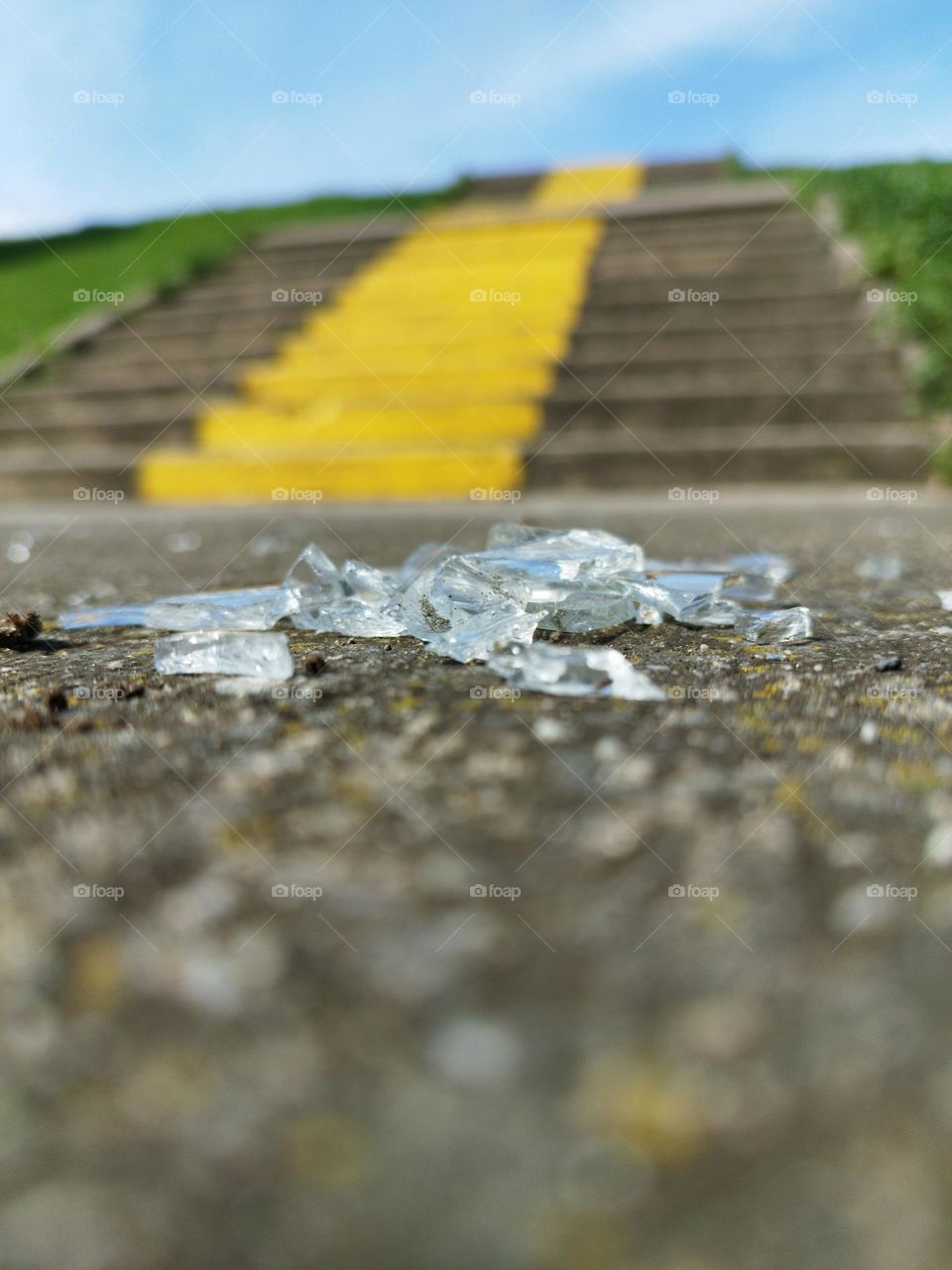 Broken glass on the ground and yellow perspective