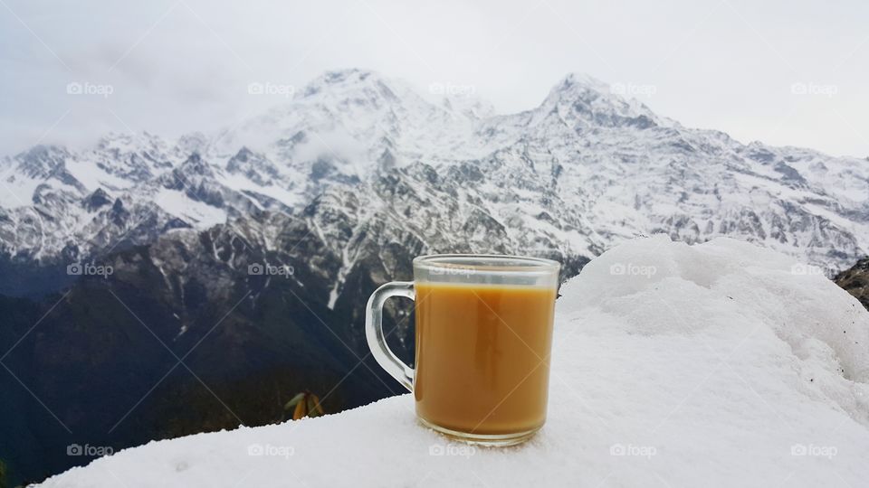 A cup of coffee in front of himalayan 
Cheers!!! 🎉🎉
