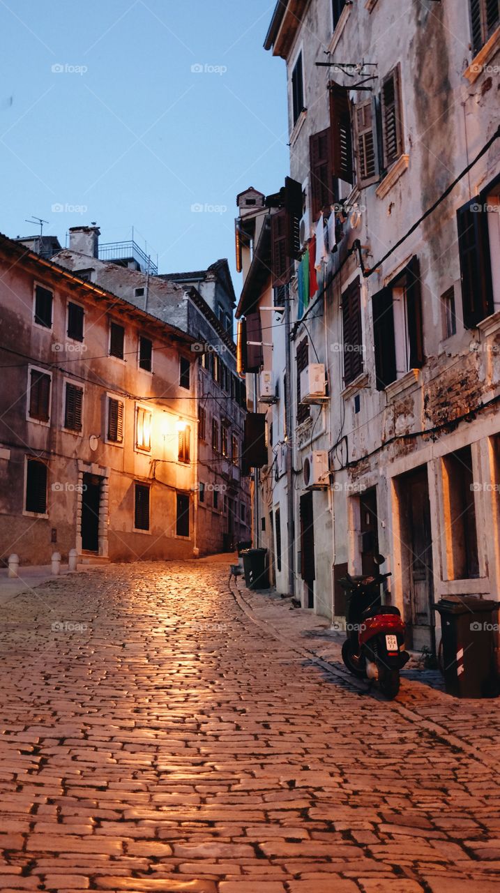 An empty cobblestone street at dusk in Rovinj, Croatia