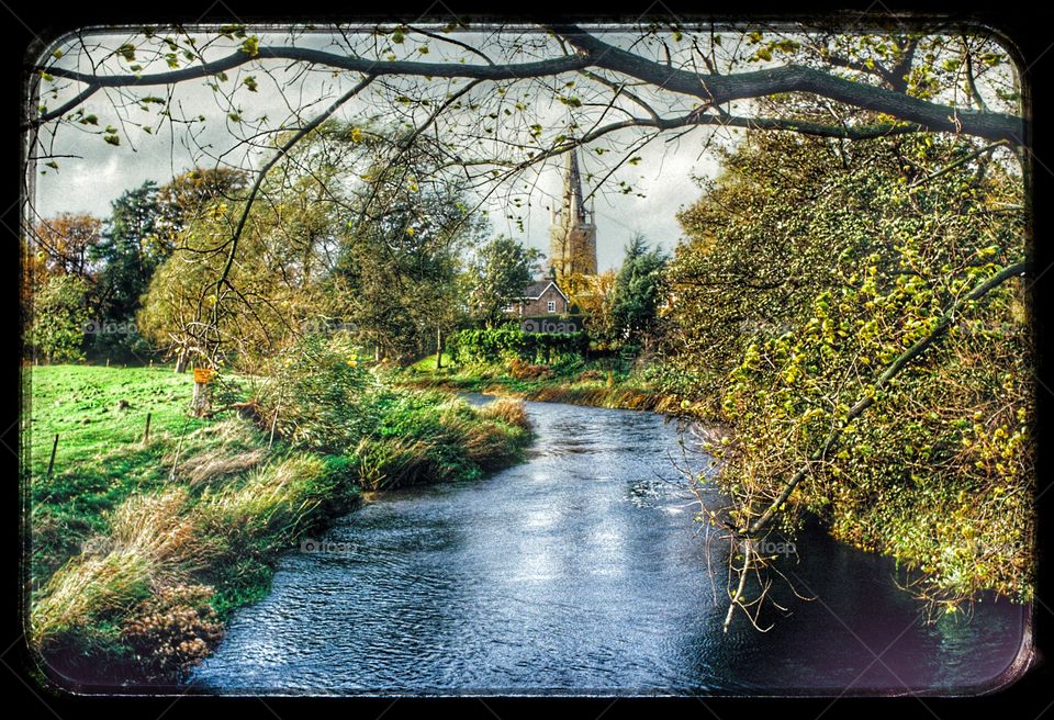 Church. English landscape church and river  