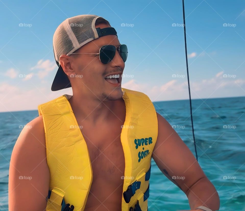 Sailing effortlessly on the Caribbean Sea, bathed in sunshine. The catamaran glides effortlessly over the turquoise waves, skirting Jamaica's 7-mile beach, capturing a perfect, joy-filled day under the radiant Caribbean sun.