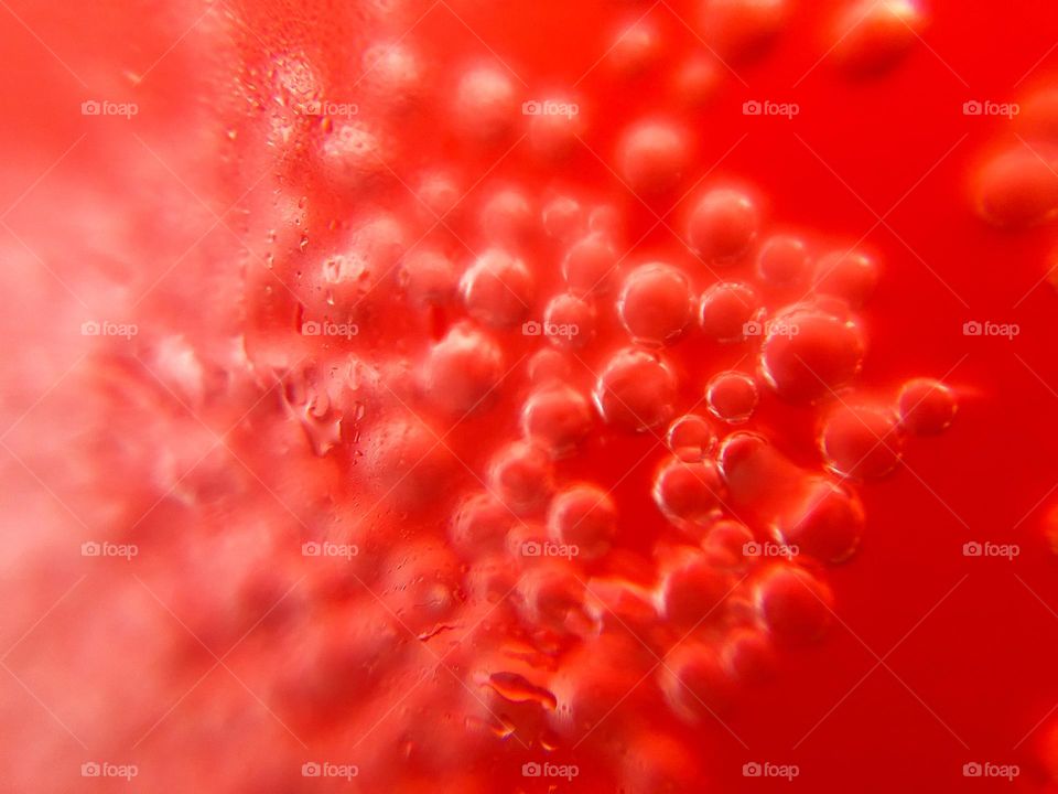 Bubbles in the red drink