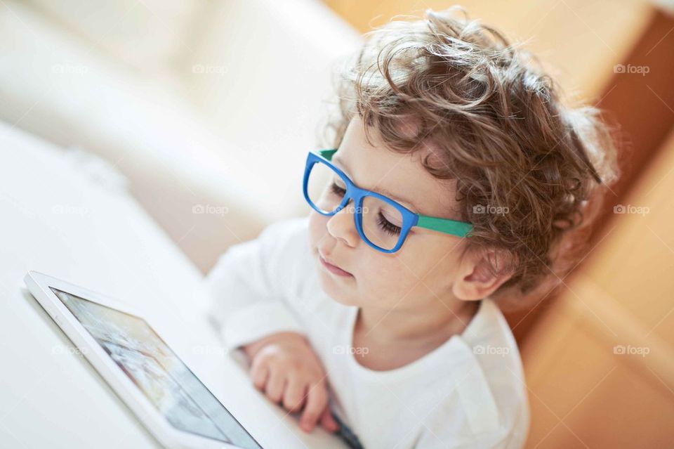 Boy with Glasses reading