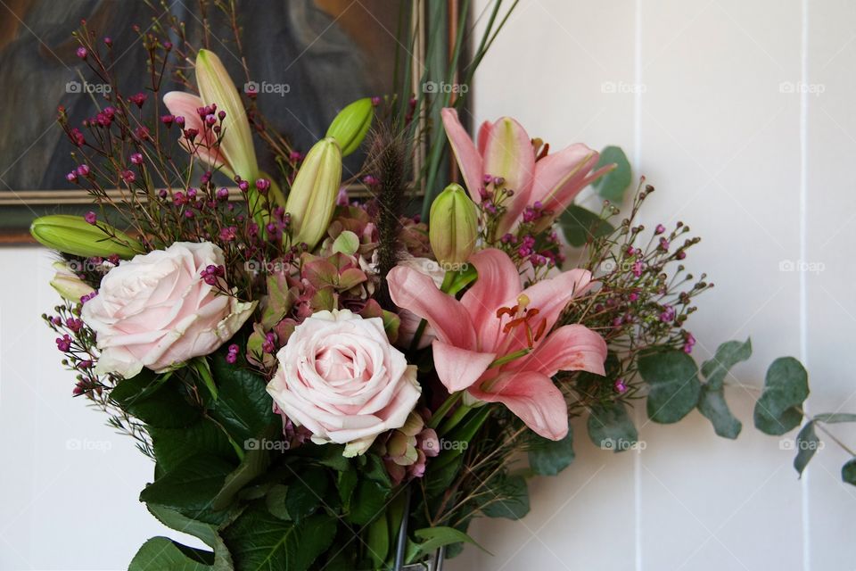 Close-up of flower bouquet against wall