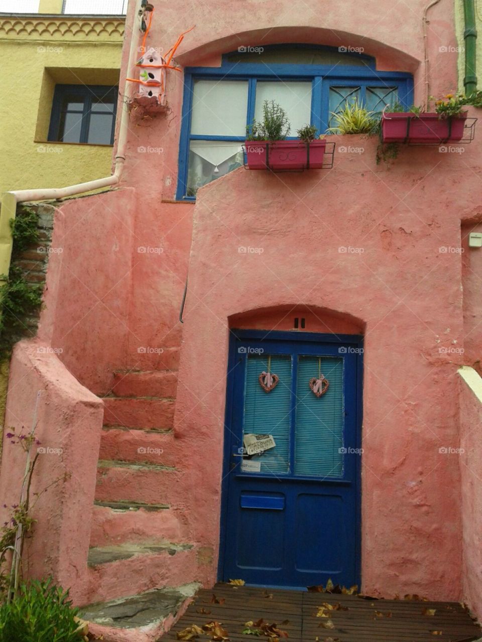 blue door to amazing old colorful house in Spain