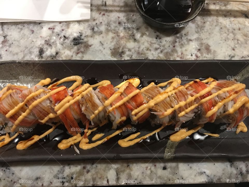 Sushi sundae roll with crab mix and shrimp tempura