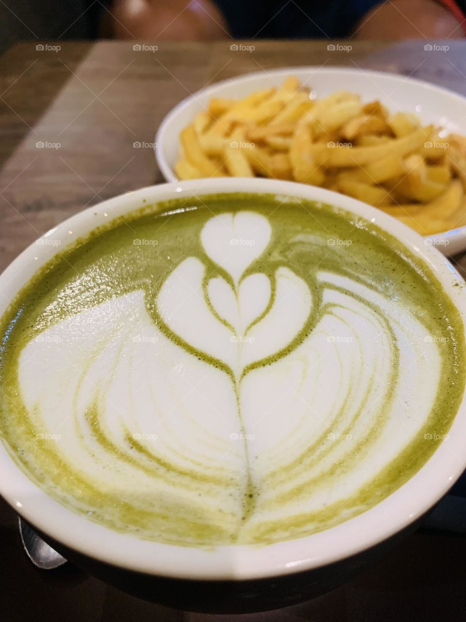 Hot matcha latte in a cup