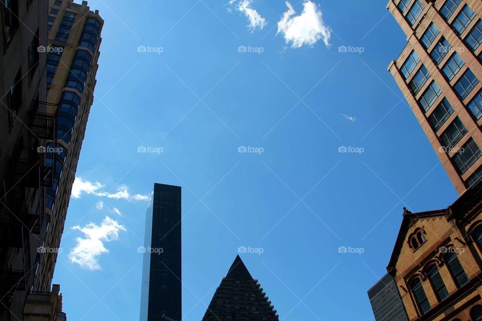 Photo in New York City of its Buildings and Sky