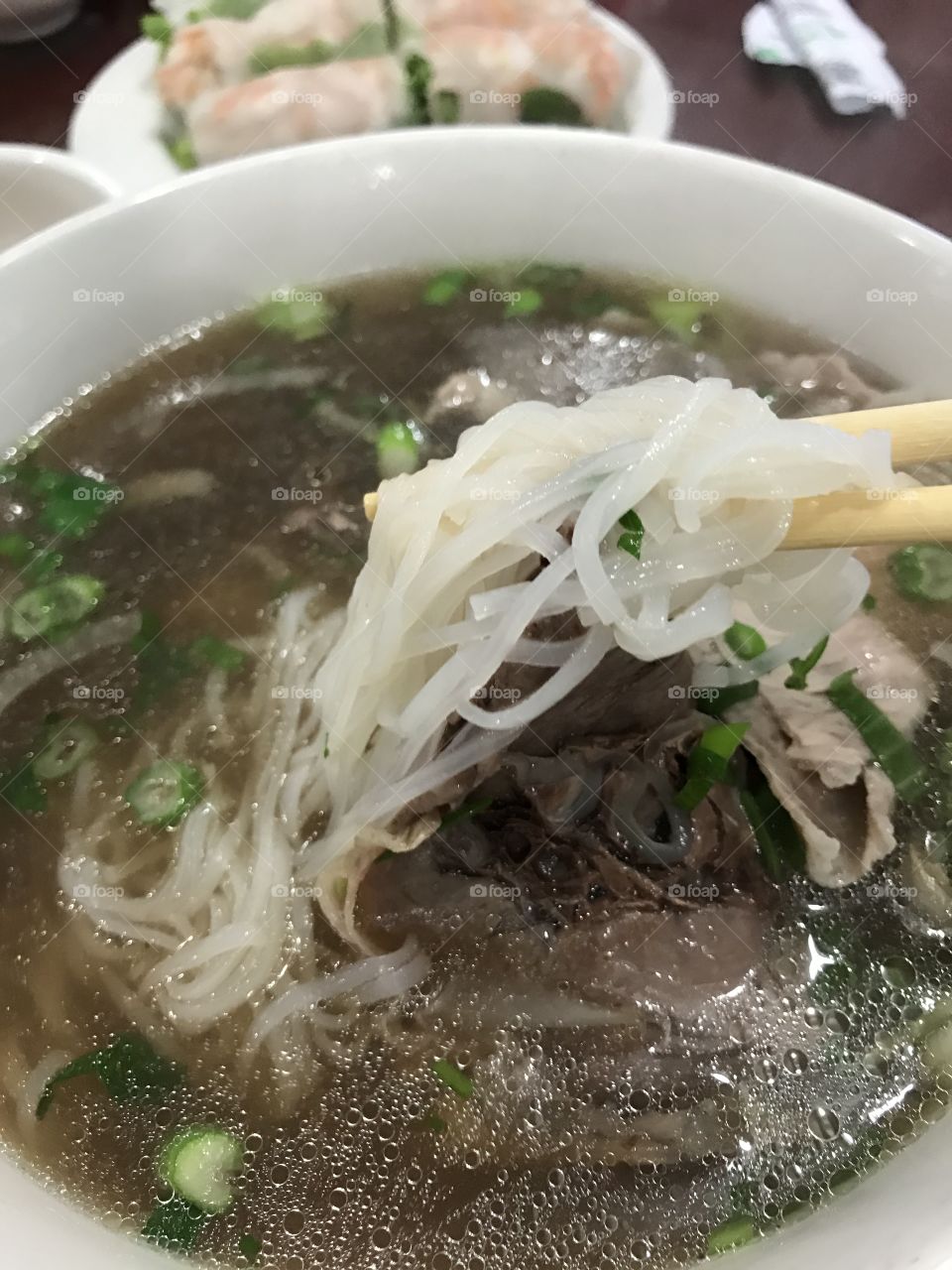Dac Biet Pho (Special Combo with rare steak well done and brisket flank tendon) at Pho Ha Nam Ninh in San Francisco for Lunch on a rainy Tuesday.