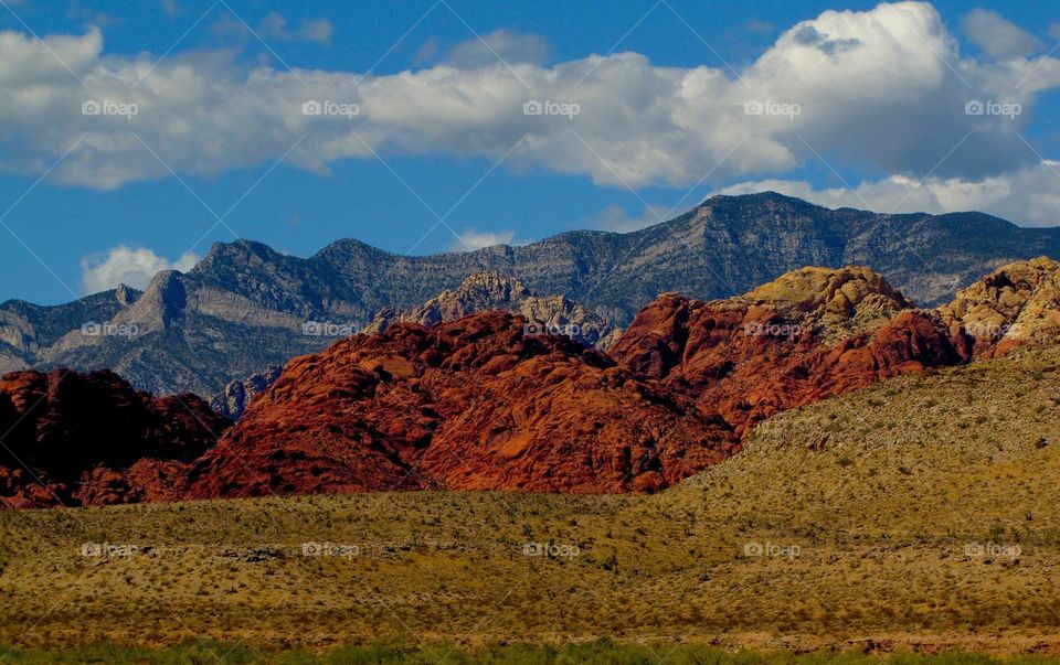 sky , mountains, and desert land