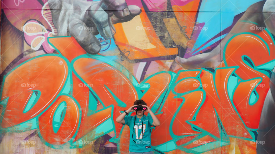 Miami Dolphins Hard Rock Stadium wall art painting and kid with binoculars jersey