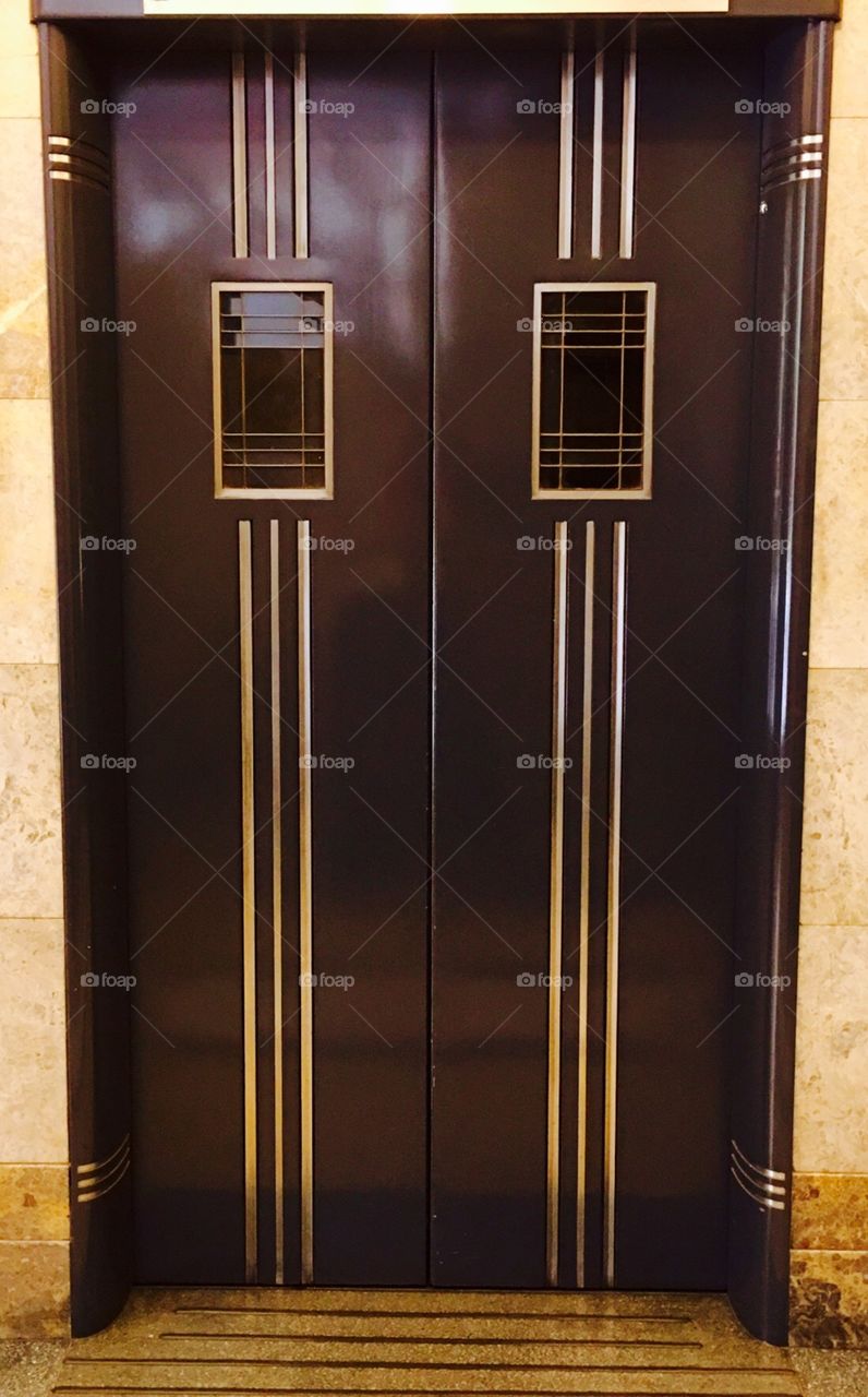 Double doors to an old world lift