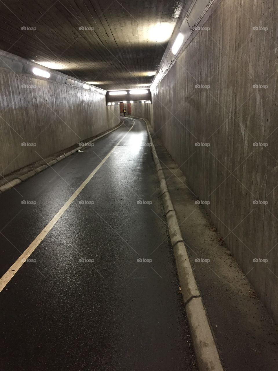 A lonely walk in a tunnel  a dark night...