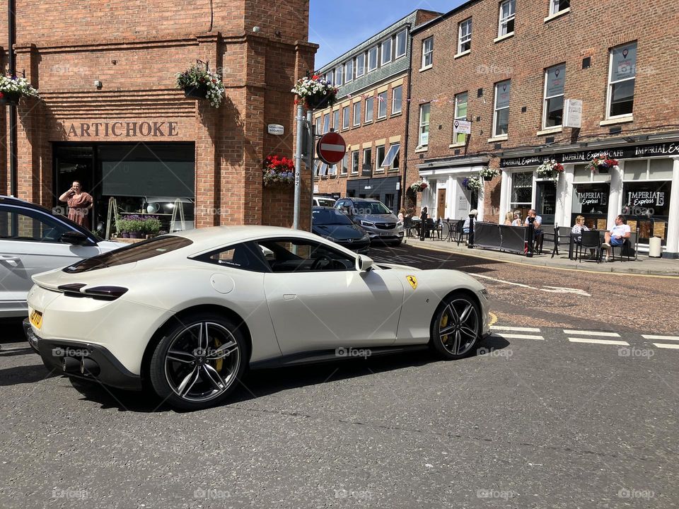 A cream coloured Ferrari 